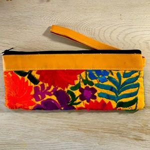 Floral/multi colored. wristlet- zipper closure
